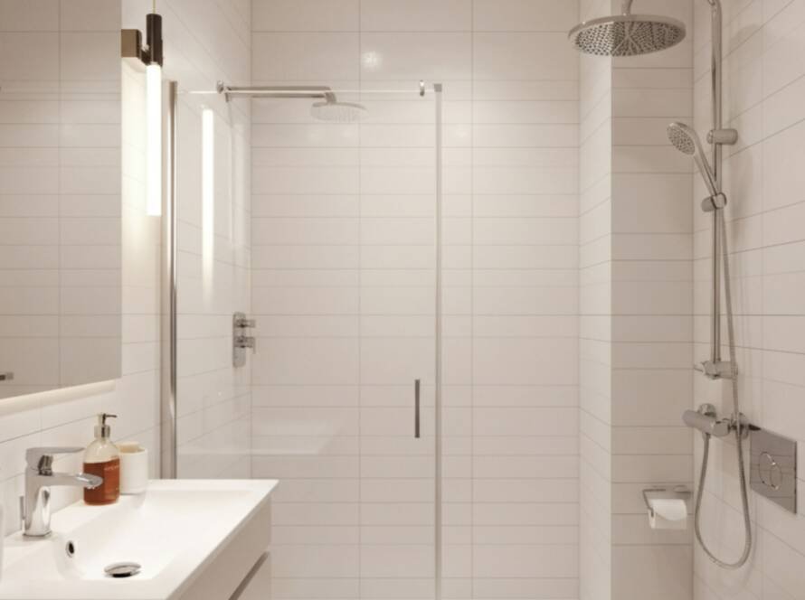 Modern 5x8 bathroom remodel featuring sleek white tiles, a glass shower, and contemporary fixtures that highlight efficiency and elegance. Perfect example for understanding 'How Long Does a 5x8 Bathroom Remodel Take?