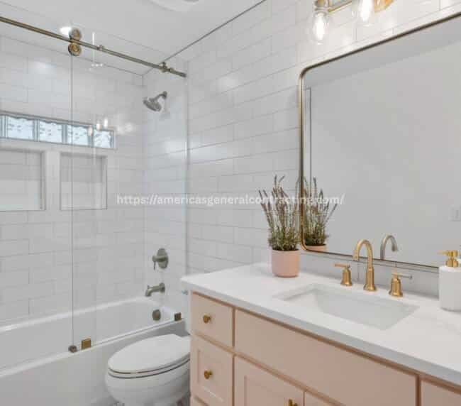 Contemporary bathroom featuring a glass-enclosed bathtub, white subway tiles, and gold fixtures, perfect for bathroom remodeling in Dallas