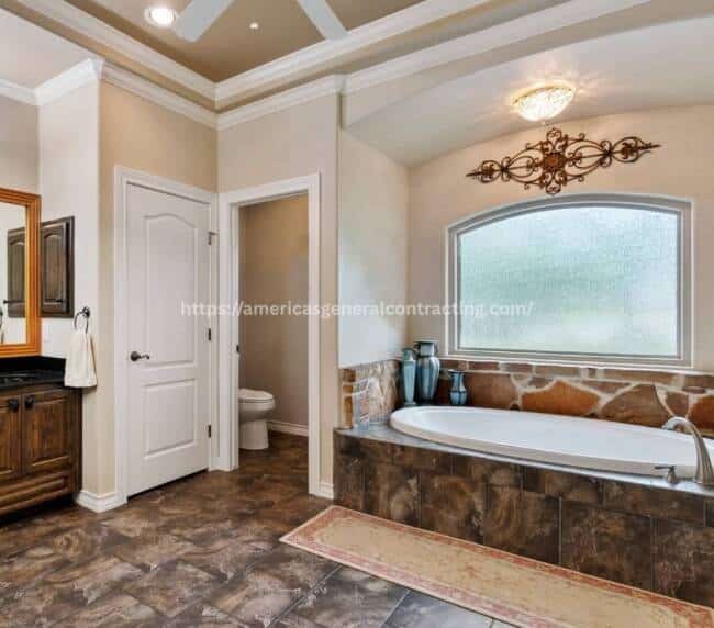 Spacious bathroom with a central bathtub, double vanity, and natural light, showcasing premium bathroom remodeling in Dallas