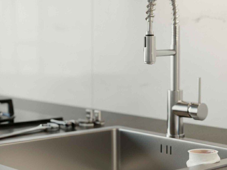 Modern kitchen sink with faucet tools.